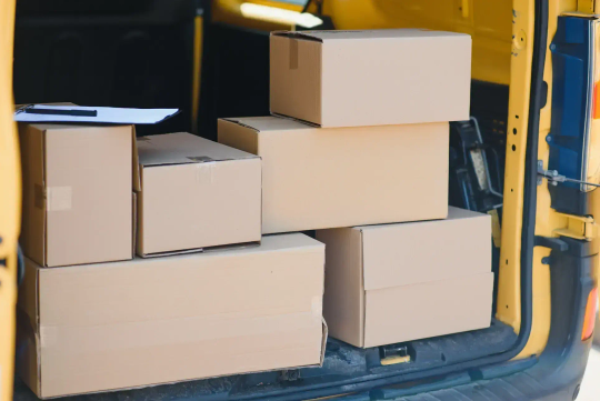 Boxes loaded into a Sprinter van